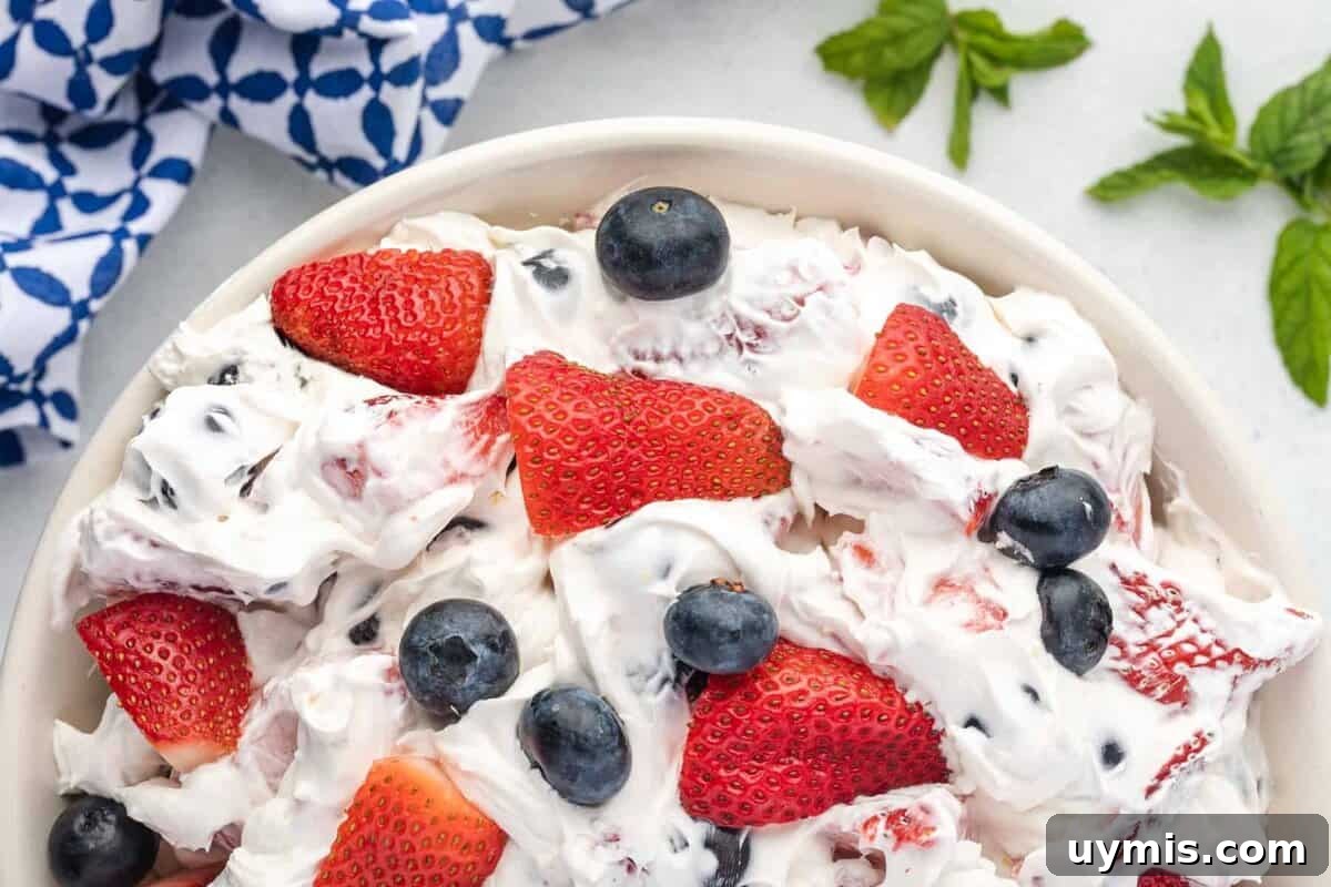 Labor Day Dessert Recipes for Summer Cookouts 3 cheesecake salad with strawberries and blueberries