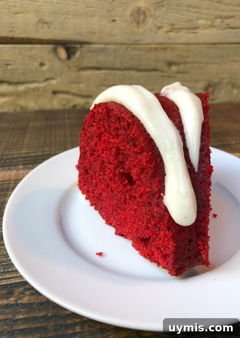 Red Velvet Bundt Cake with Cinnamon Cream Cheese Glaze Slice of Red Velvet Bundt Cake