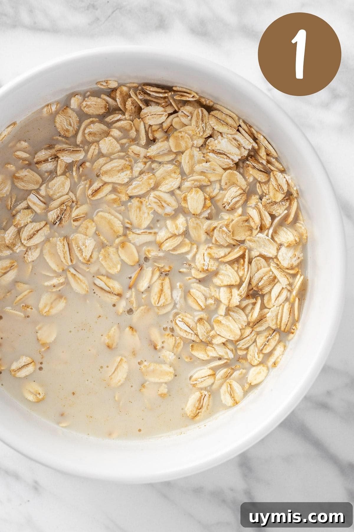 A process photo illustrating step 1: mixing the milk and oats together.