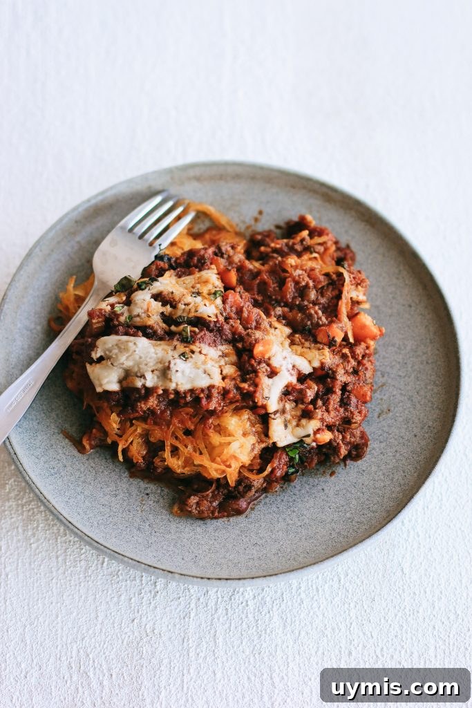 Spaghetti squash bake on a grey plate with fork