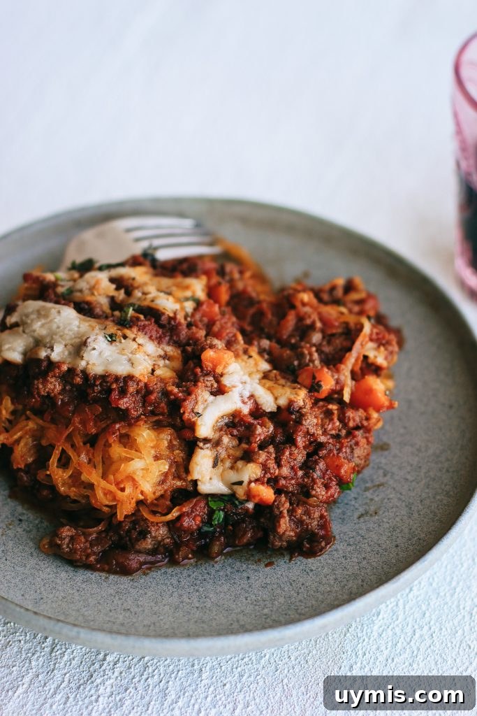 Spaghetti squash bake on a grey plate with fork