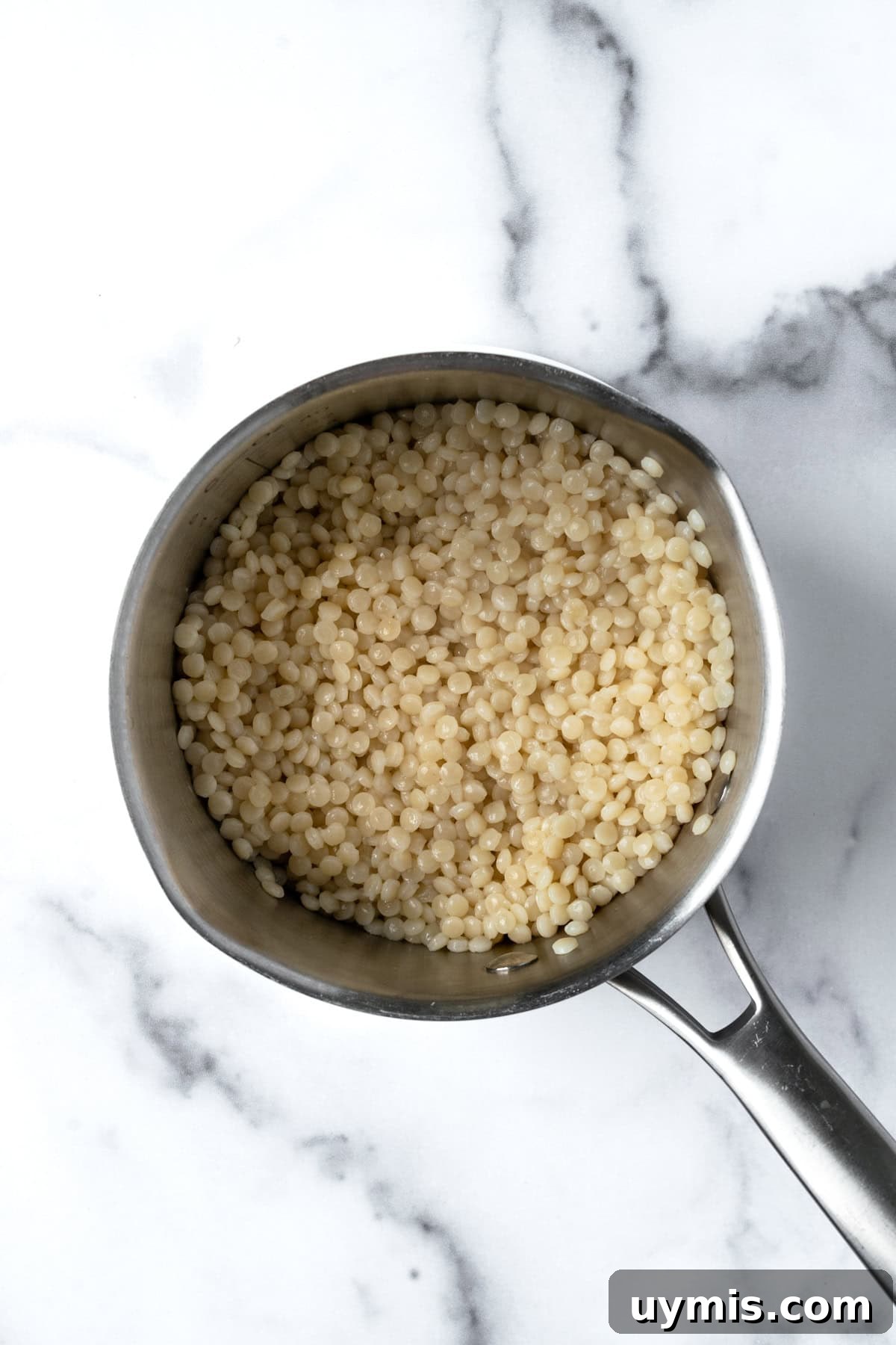 Zesty Summer Couscous Salad with Fresh Herbs 4 Cooked Pearl Couscous in a stainless steel pot.
