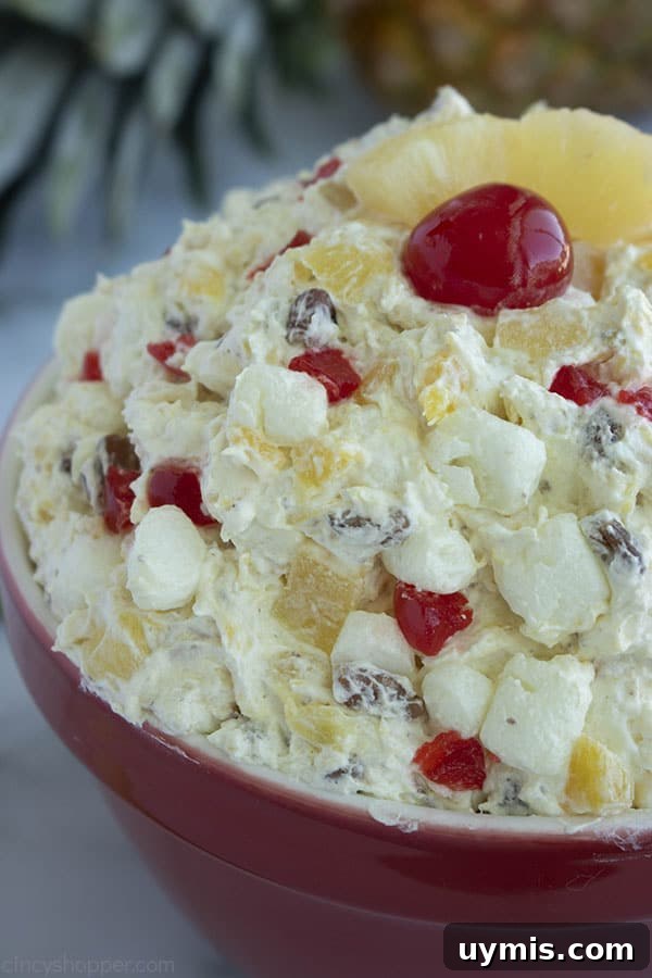 Fluffy Pineapple Salad with Marshmallows and Whipped Cream 2 Fluffy Pineapple Salad in a red bowl.