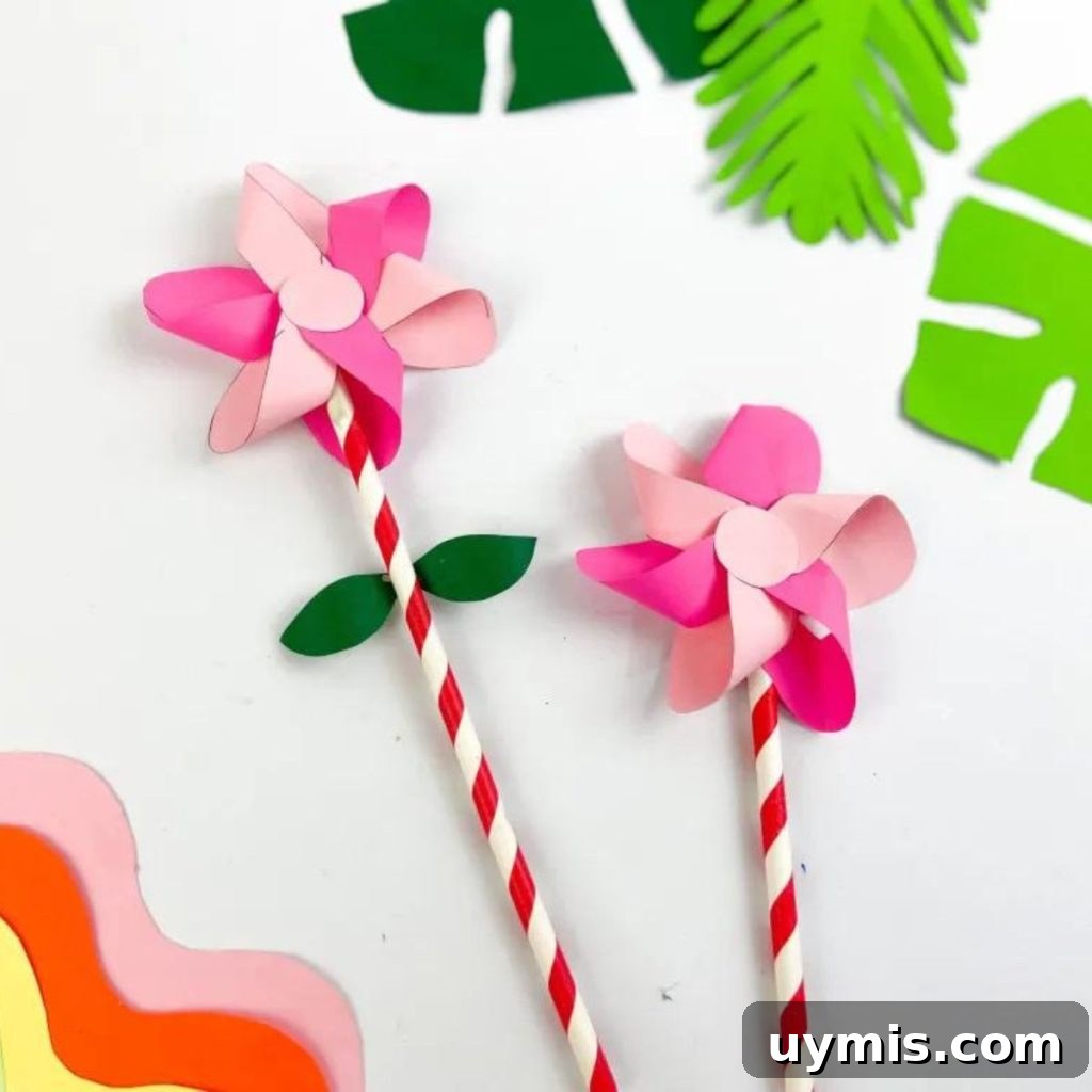 16 Paper Flower Crafts to Make This Spring 3 PINK SPRING FLOWER WITH LEAVES