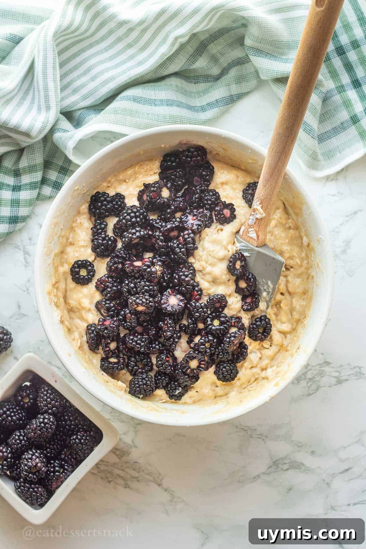 Banana Blackberry Oatmeal Muffins with Rolled Oats 8 Blackberries in raw banana oat muffin batter.