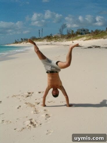 Erich doing a handstand on the beach in the Bahamas.