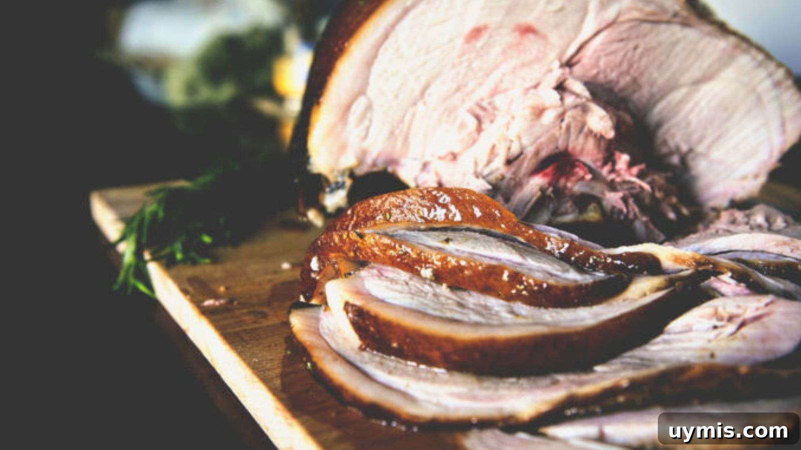21 Elegant Easter Main Courses for a Stunning Holiday Table 15 Smoked ham sliced thick with caramelized glaze and visible smoke ring across the edges.