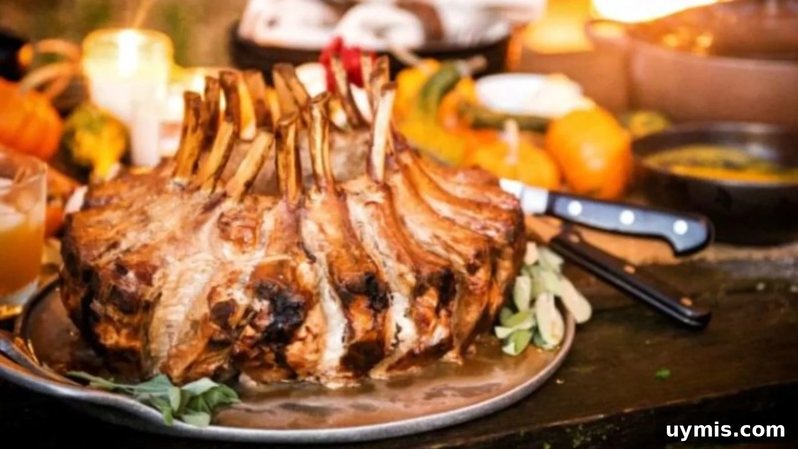 21 Elegant Easter Main Courses for a Stunning Holiday Table 6 Smoked pork crown roast with caramelized bark and exposed bones arranged on a wooden platter.