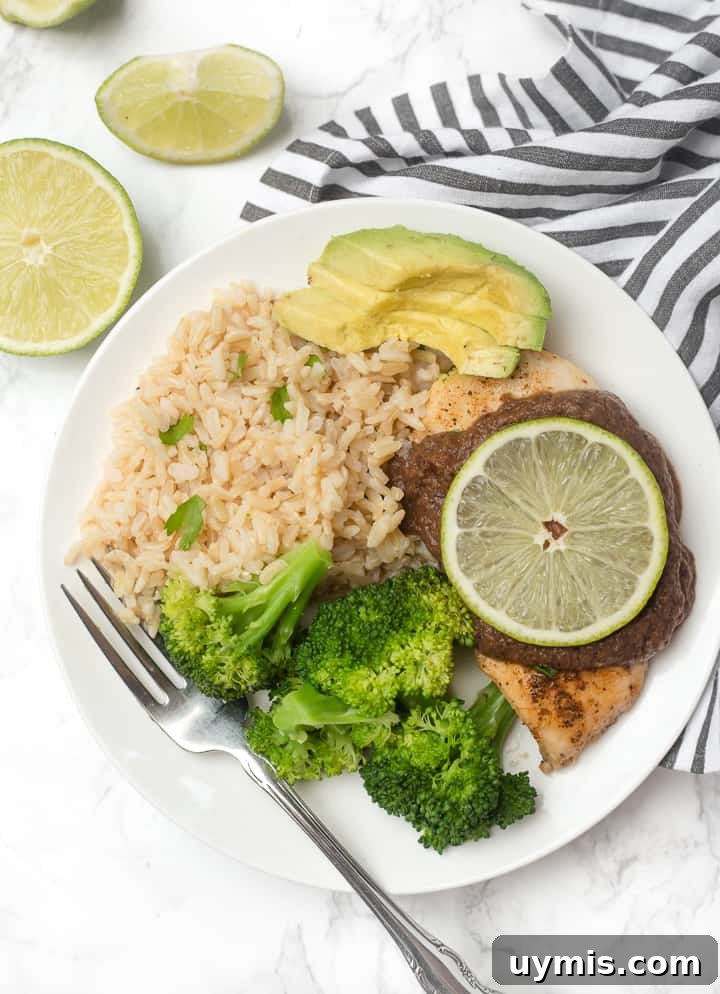 Skillet Chicken with Black Bean Sauce: an easy weeknight dinner that makes chicken breasts actually exciting and delicious! Plate of skillet chicken with black bean sauce