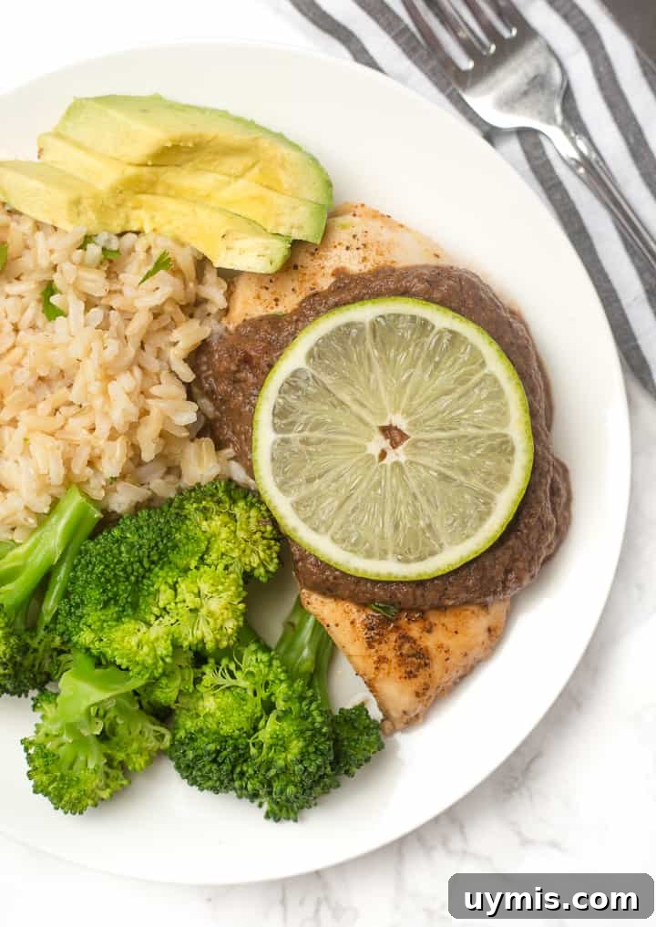 Skillet Chicken with Black Bean Sauce: an easy weeknight dinner that makes chicken breasts actually exciting and delicious! Plate of Mexican Skillet Chicken with Black Bean Sauce