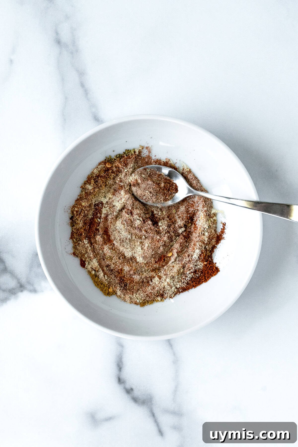 Homemade Ground Turkey Taco Seasoning Mix 4 Homemade Turkey Taco Seasoning in white bowl with a spoon.