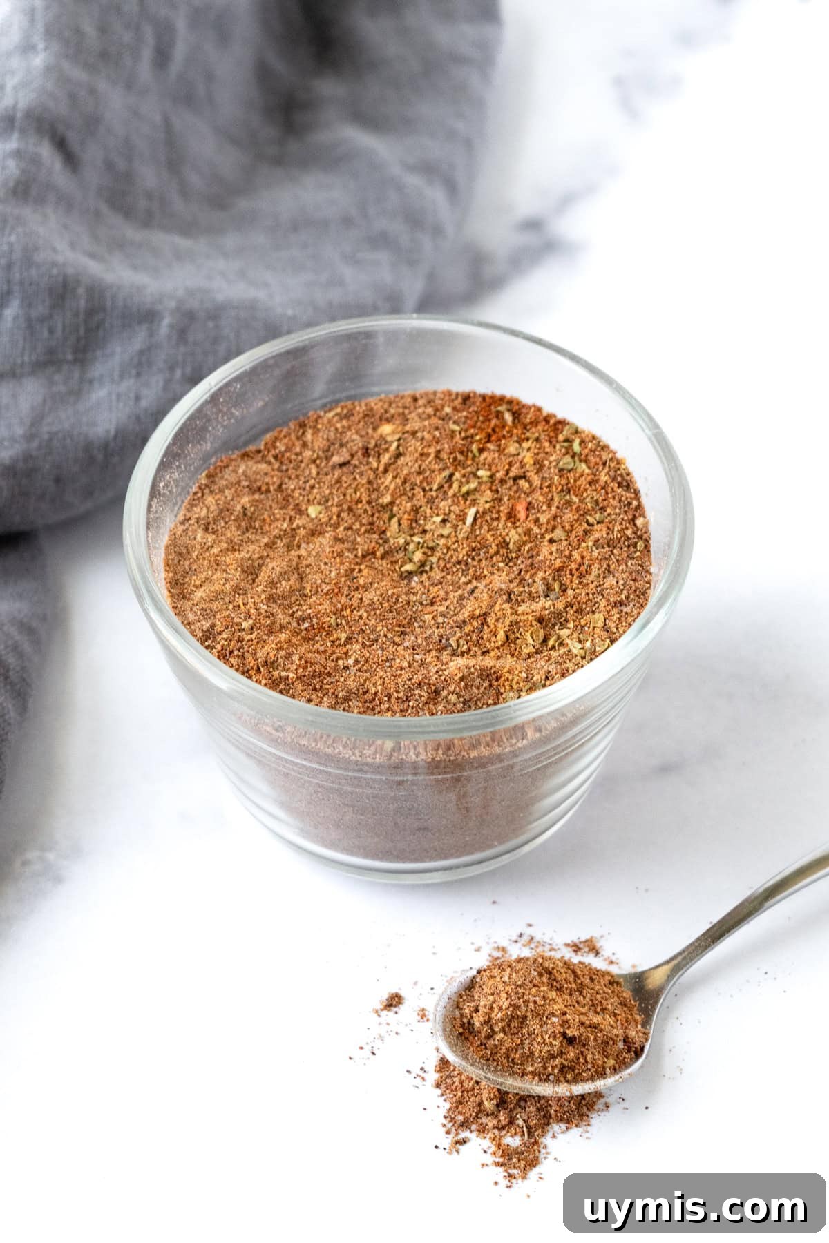 Homemade Ground Turkey Taco Seasoning Mix 7 A small glass bowl with homemade Ground Turkey Taco Seasoning on a marble countertop.