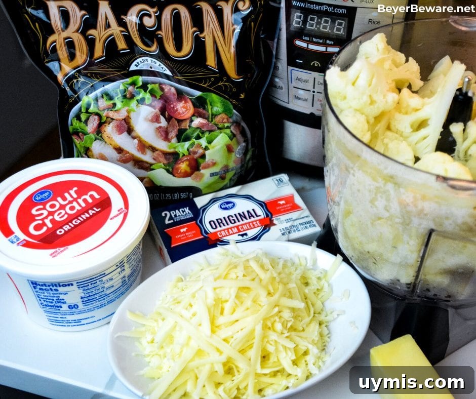 Loaded Keto Mashed Cauliflower Casserole 4 Keto mashed cauliflower casserole is loaded with white cheddar cheese and bacon while made smooth as mashed potatoes with sour cream and cream cheese as it bakes to perfection.