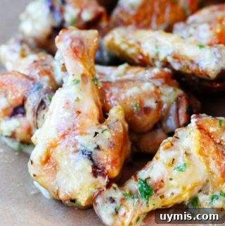 Crispy Garlic Parmesan Chicken Wings Recipe 6 Garlic parmesan chicken wings on a board
