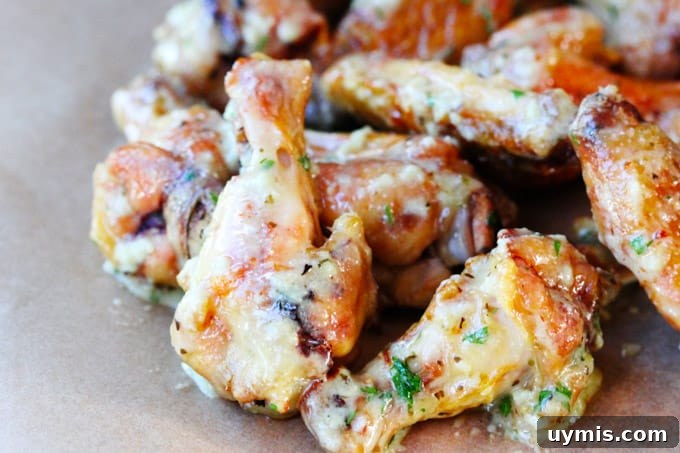 Garlic Parmesan chicken wings served on a board Garlic parmesan chicken wings on a board